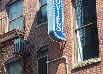 The old signage from the Movies on Exchange, at 10 Exchange Street, viewed from the outside in 2024.