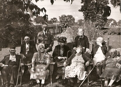 Men and women enjoying summer in the gardens at the Jewish Home for Aged in the 1930s. 