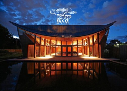An exterior view of Congregation Bet Ha'am at night.